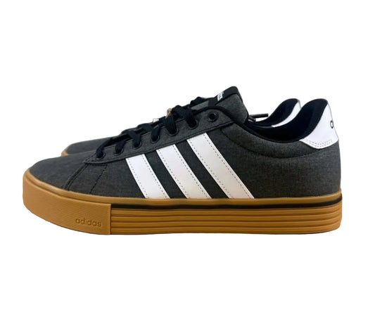 Adidas Daily 4.0 Men’s Canvas Skate Shoes in Charcoal/White/Gum on a wooden surface.