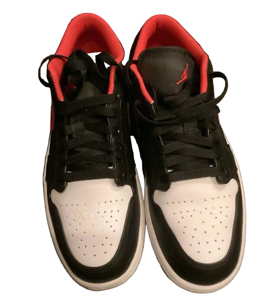 Air Jordan 1 Low Black White Fire Red sneakers showcasing sleek black and white design with Fire Red accents.