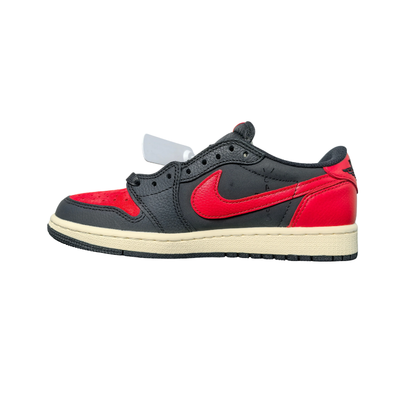 Nike Travis Scott x Air Jordan 1 Low Bred Sneakers side view showcasing red and black design with off-white midsole.