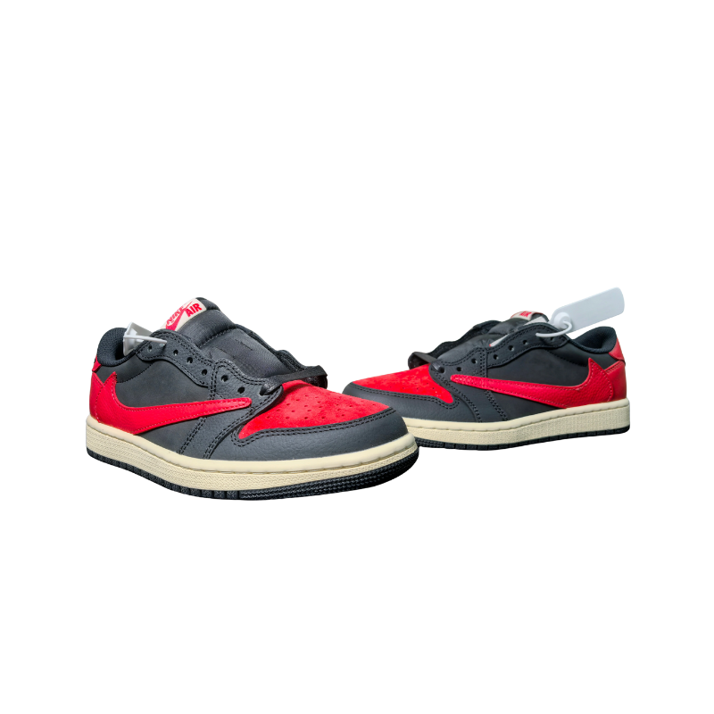 Nike Travis Scott x Air Jordan 1 Low Bred Sneakers featuring red and black colors with a sail midsole.
