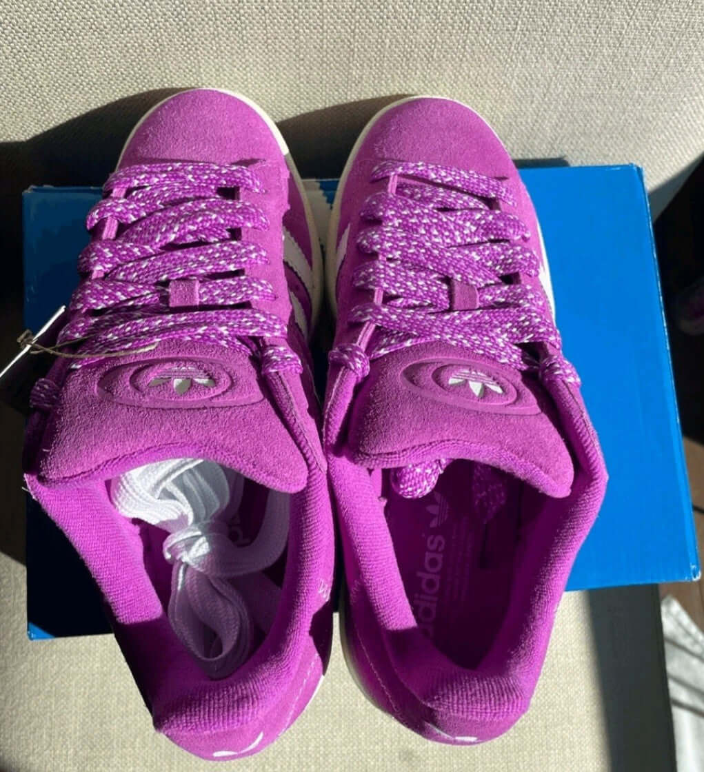 Adidas Campus 00s Women’s Sneakers in Purple Burst suede with stylish laces on blue box.