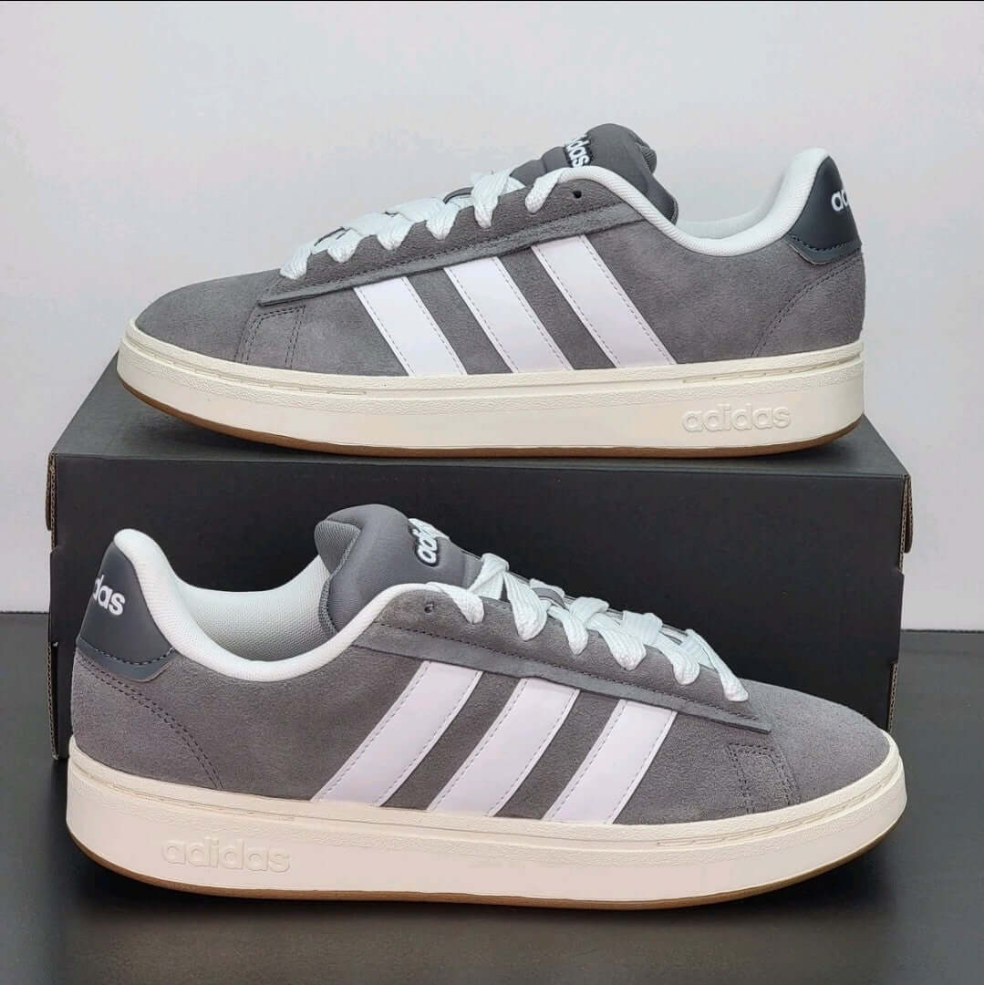 Adidas Grand Court Alpha sneakers – Gray/White Casual Shoes with classic court style on a display box.