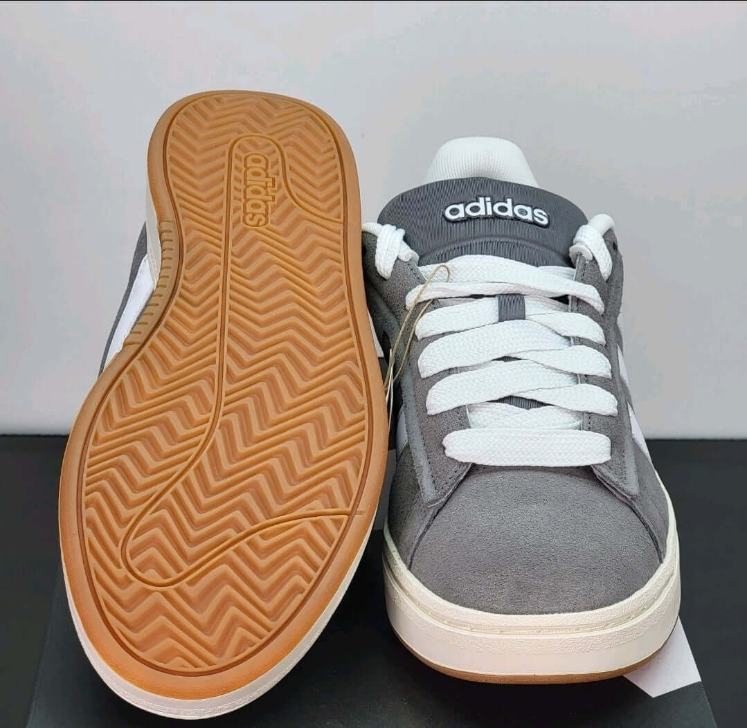 Adidas Grand Court Alpha sneakers in gray and white with a rubber sole, showcasing classic casual court style.