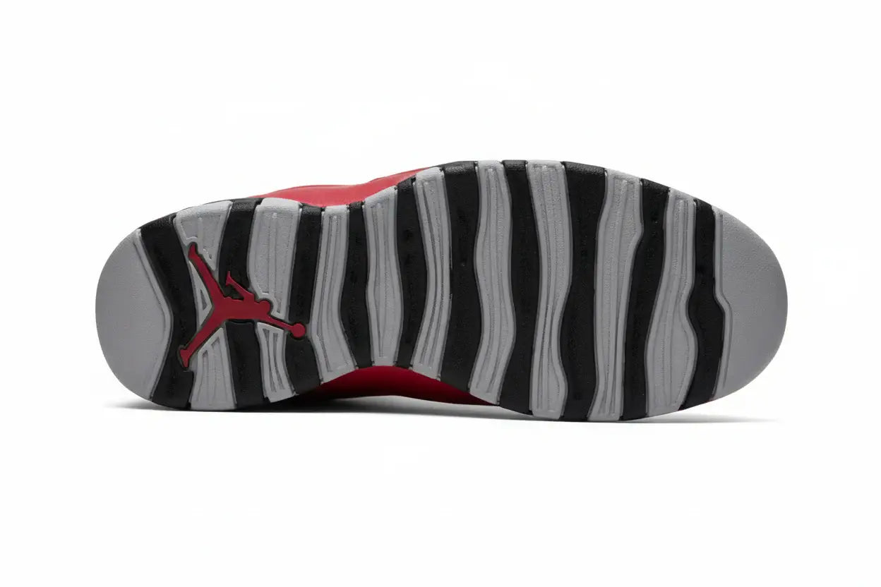 Air Jordan 10 “Bulls Over Broadway” – Gym Red/Black/Wolf Grey | AJ10 outsole view showing black and grey patterned design.