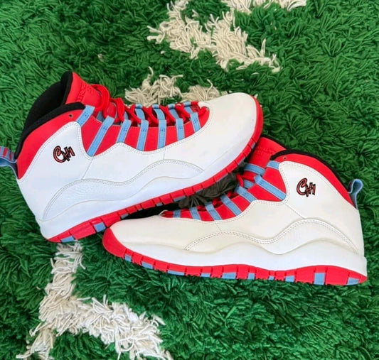 Air Jordan 10 Retro “Chicago Flag” sneakers showcasing iconic design and Chicago city flag colors on a green background.