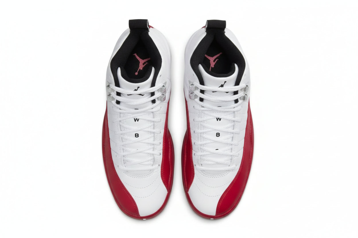 Air Jordan 12 “Cherry” Sneakers featuring a white, black, and varsity red design, showcasing a classic retro style.