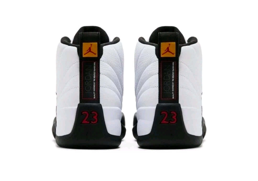 Air Jordan 12 “Taxi” sneakers rear view showcasing iconic black and gold detailing and classic design.