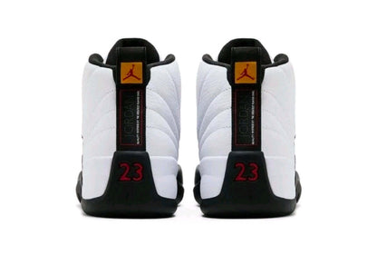 Air Jordan 12 “Taxi” sneakers rear view showcasing iconic black and gold detailing and classic design.