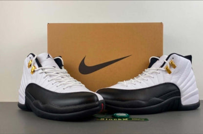 Air Jordan 12 “Taxi” sneakers displayed with a Nike box, showcasing their iconic black-and-gold design.