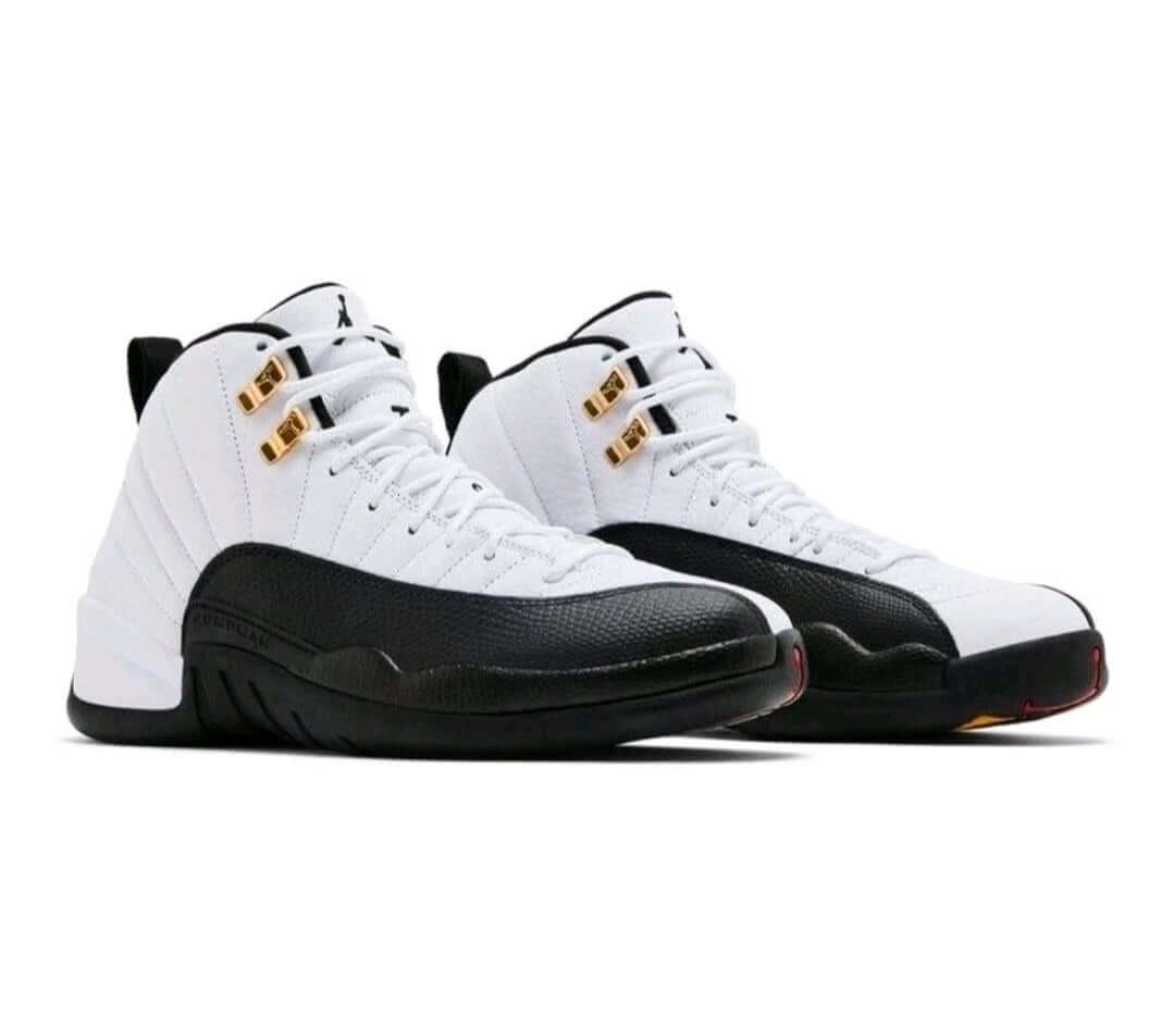 Air Jordan 12 “Taxi” sneakers featuring iconic black-and-gold detailing and a classic retro design.