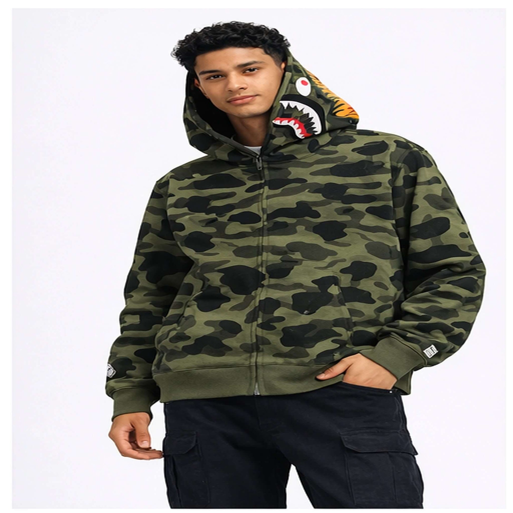 BAPE Shark Hoodie Collection – Camo Full Zip Double Hood Streetwear worn by a model featuring bold camo patterns.