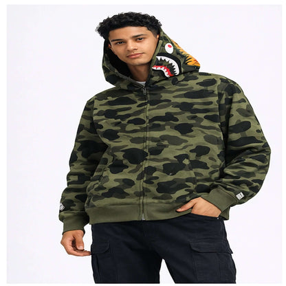 BAPE Shark Hoodie Collection – Camo Full Zip Double Hood Streetwear worn by a model featuring bold camo patterns.