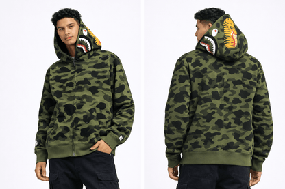 BAPE Shark Hoodie Collection – Camo Full Zip Double Hood Streetwear featuring a model wearing a bold camo hoodie with shark details.