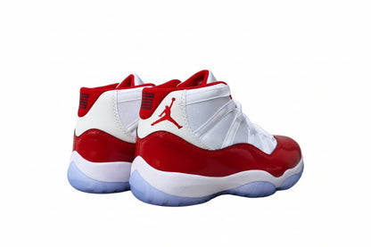Air Jordan 11 “Win Like ’96” shoes featuring red and white colorway with iconic design.